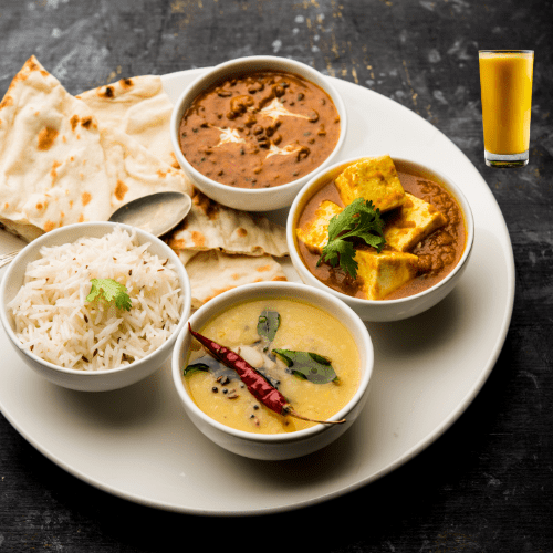 plate of indian food and lassi